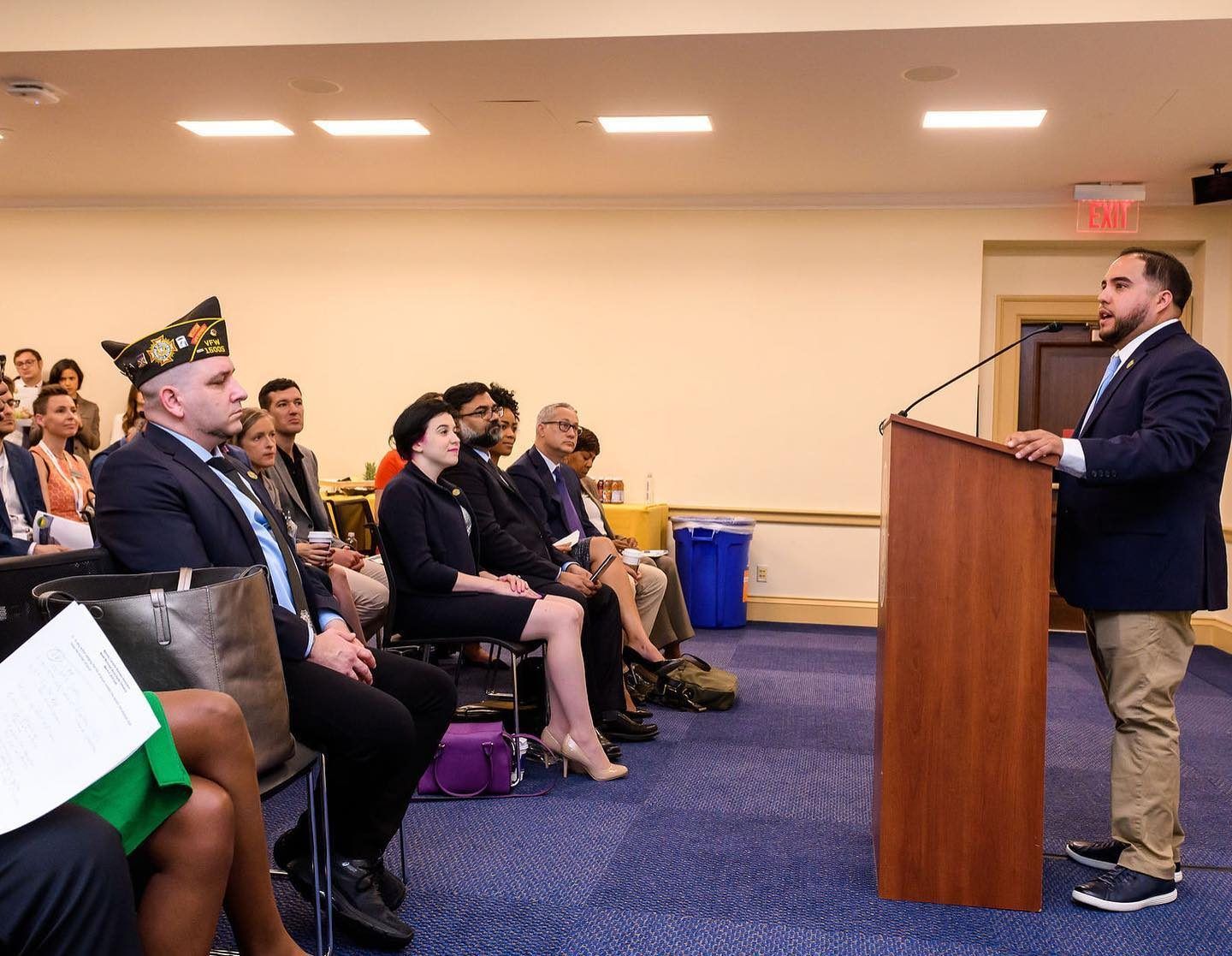 An audience listening to a speaker at a policy briefing